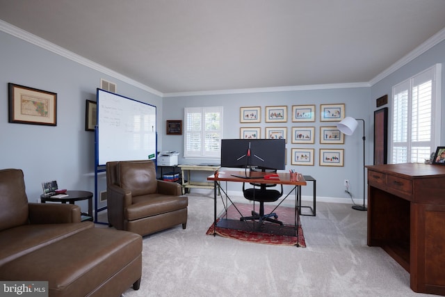 office space featuring ornamental molding, light colored carpet, visible vents, and a healthy amount of sunlight