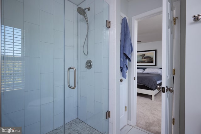 bathroom featuring a shower stall and connected bathroom