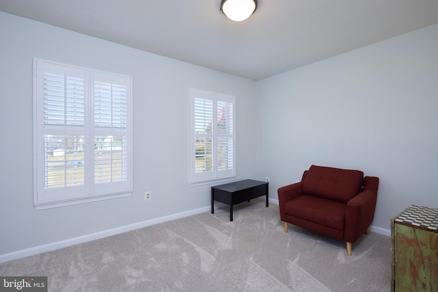 sitting room with carpet flooring and baseboards