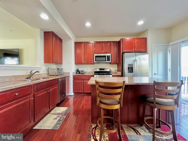 kitchen featuring a sink, dark brown cabinets, and stainless steel appliances