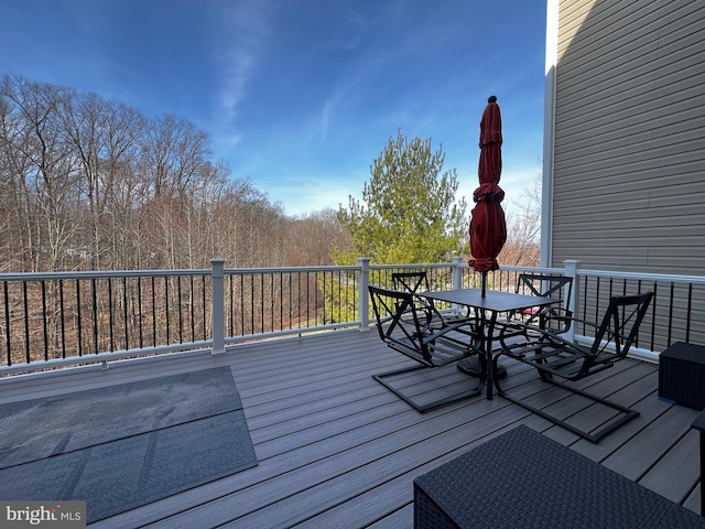 wooden deck with outdoor dining area