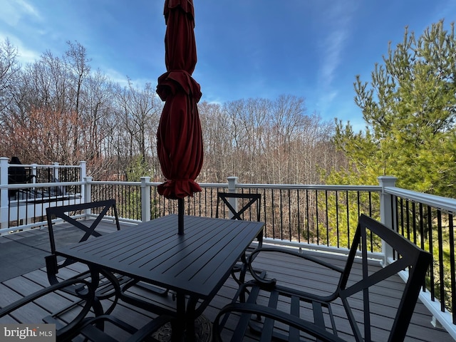 deck featuring outdoor dining area