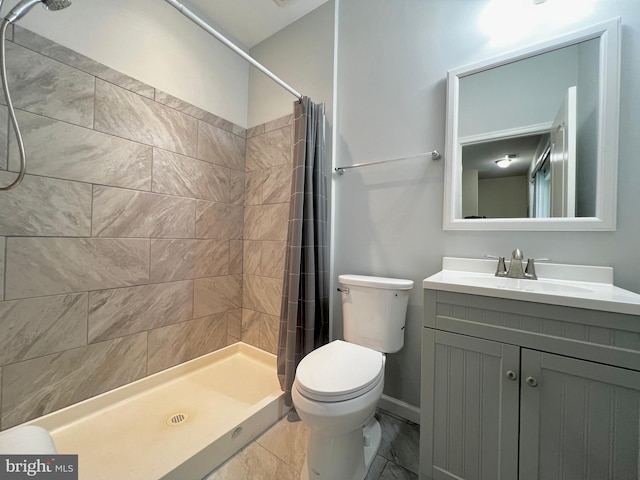 full bath with toilet, a stall shower, vanity, and marble finish floor