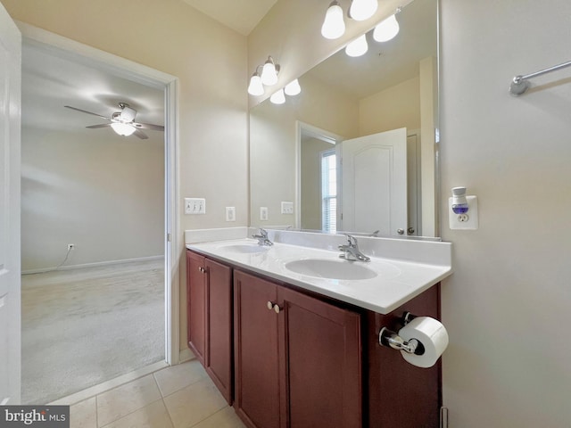 bathroom featuring double vanity, tile patterned floors, ceiling fan, and a sink