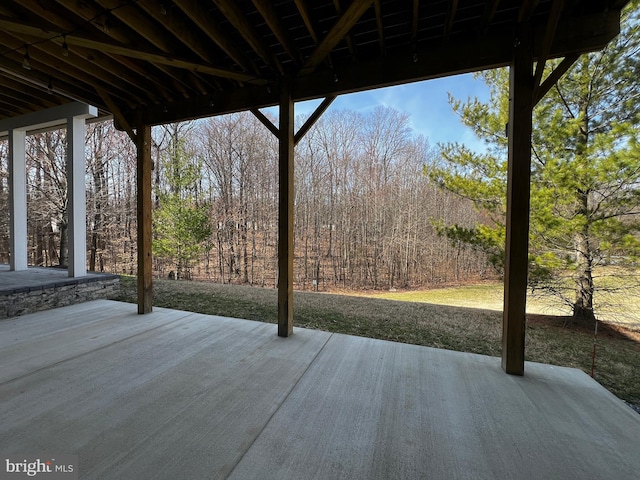 wooden terrace with a patio