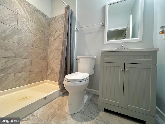 full bath with vanity, baseboards, a stall shower, toilet, and marble finish floor