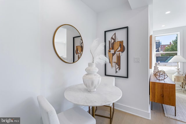 interior space with light wood finished floors, recessed lighting, and baseboards