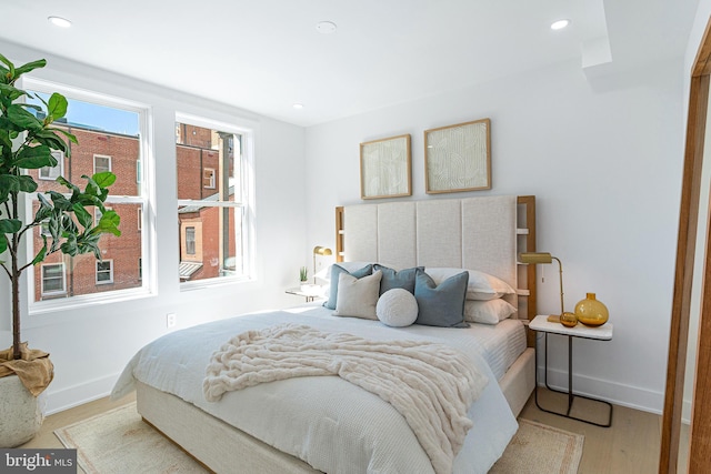 bedroom featuring recessed lighting, baseboards, and wood finished floors