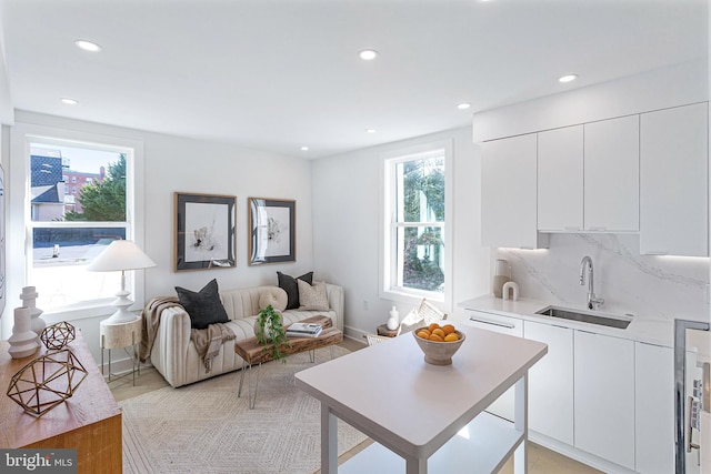 living room featuring recessed lighting and a healthy amount of sunlight