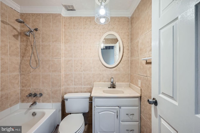 bathroom featuring vanity, tile walls, visible vents, and ornamental molding