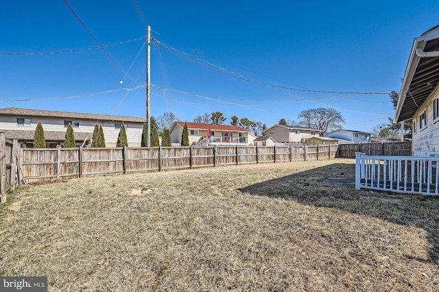 view of yard with a fenced backyard