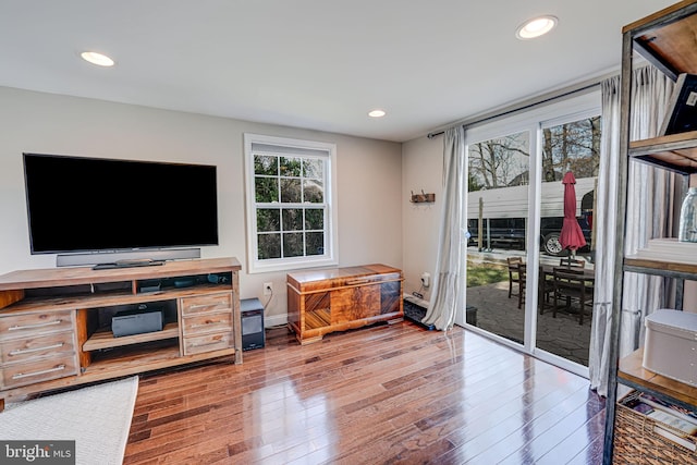 interior space featuring hardwood / wood-style floors, recessed lighting, and baseboards