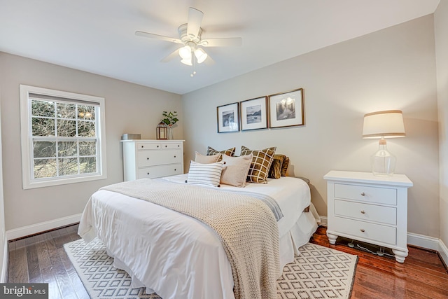 bedroom with baseboards, a ceiling fan, and hardwood / wood-style flooring