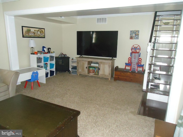 living room with visible vents and carpet flooring