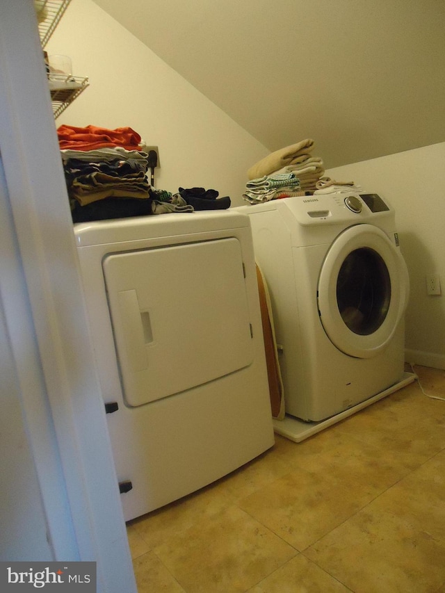 laundry area with laundry area and separate washer and dryer