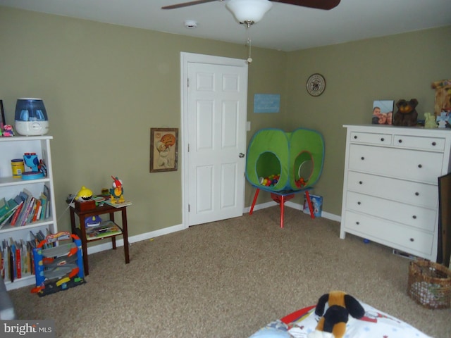 playroom featuring carpet flooring, baseboards, and ceiling fan