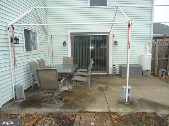 view of patio / terrace featuring outdoor dining space and fence