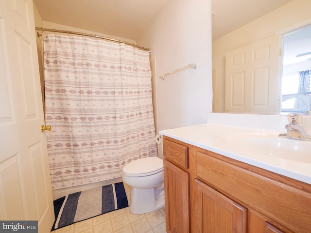 full bathroom featuring tile patterned floors, toilet, a shower with shower curtain, and vanity