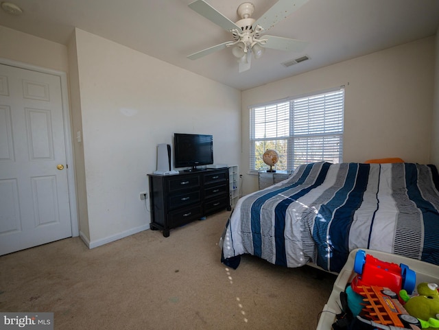 bedroom with visible vents, a ceiling fan, carpet flooring, baseboards, and vaulted ceiling