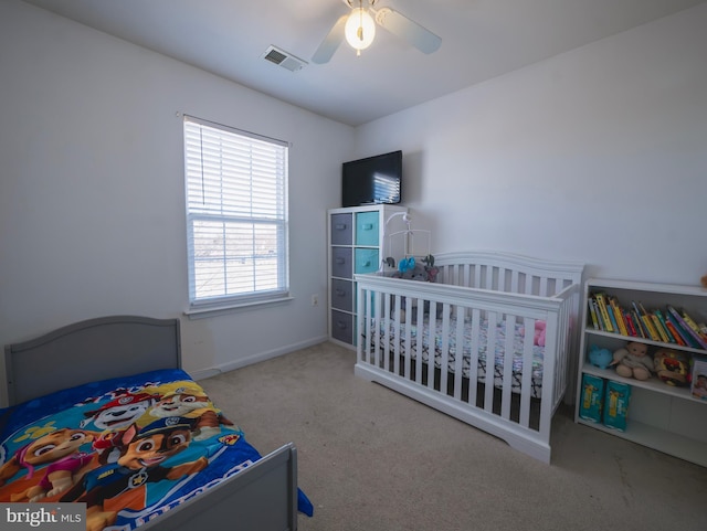 bedroom featuring visible vents, carpet flooring, baseboards, and ceiling fan