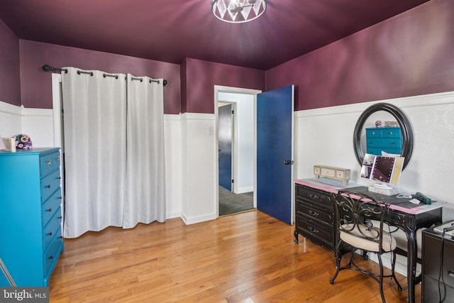 office area featuring wainscoting and light wood-style floors