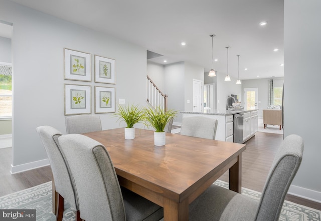 dining room with recessed lighting, stairs, baseboards, and dark wood-style flooring