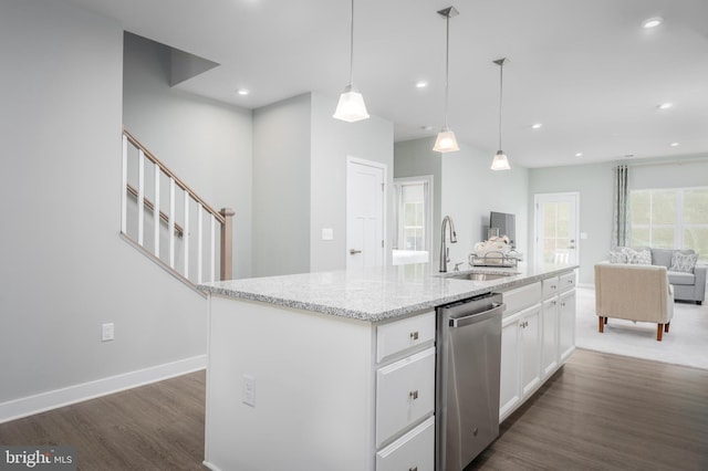 kitchen with a sink, stainless steel dishwasher, open floor plan, dark wood finished floors, and white cabinetry