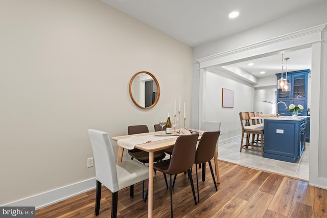 dining area with recessed lighting, baseboards, and light wood-style floors