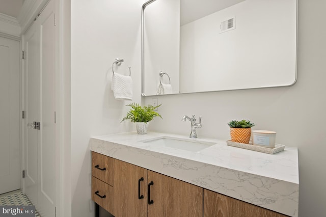 bathroom featuring visible vents and vanity