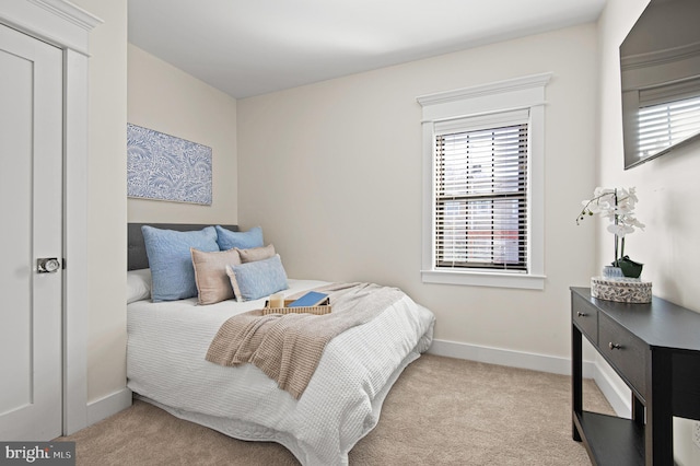 carpeted bedroom with baseboards