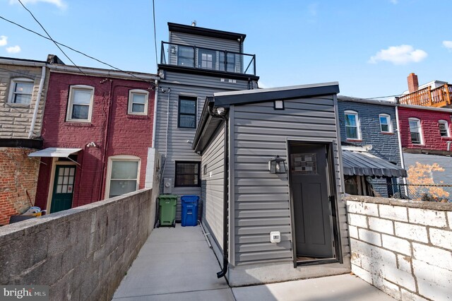 back of house featuring fence