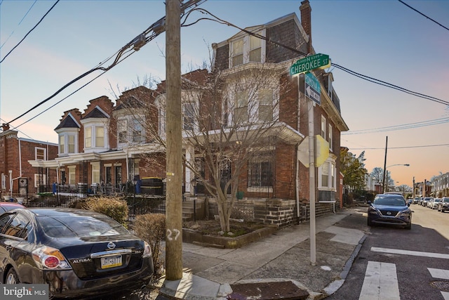 townhome / multi-family property featuring brick siding