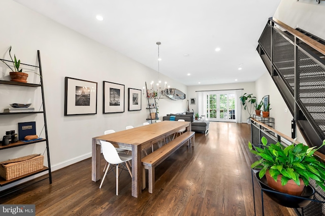 dining area featuring dark wood finished floors, a chandelier, recessed lighting, and baseboards