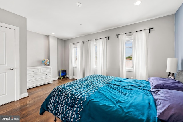 bedroom featuring recessed lighting, wood finished floors, and baseboards