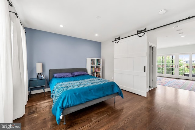 bedroom featuring access to exterior, recessed lighting, wood finished floors, and baseboards