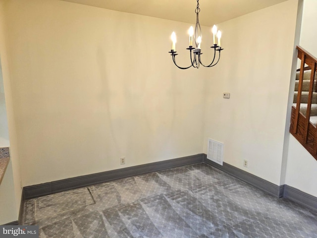 unfurnished dining area with stairway, carpet, baseboards, visible vents, and a notable chandelier