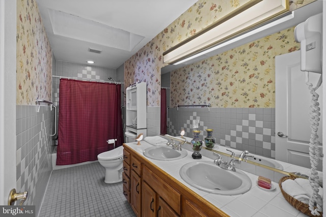 8359 Elm Rd, Millersville, MD 21108 - bathroom with wallpapered walls, tile walls, double vanity, toilet, and shower / bath combo with shower curtain