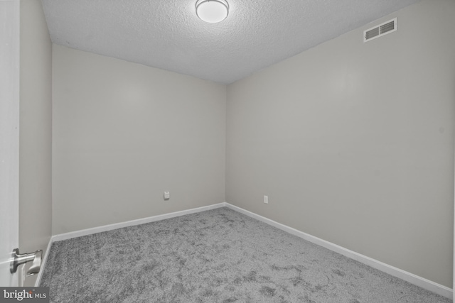 8359 Elm Rd, Millersville, MD 21108 - spare room featuring a textured ceiling, carpet flooring, and baseboards