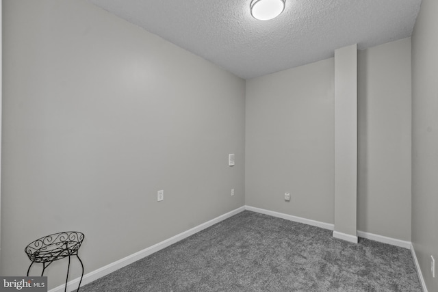 8359 Elm Rd, Millersville, MD 21108 - empty room featuring dark colored carpet, a textured ceiling, and baseboards