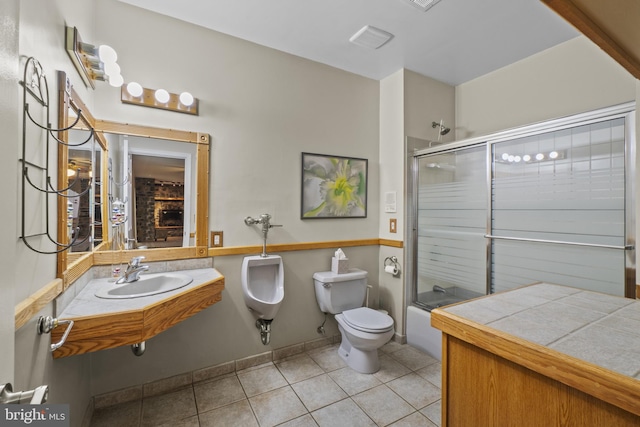 8359 Elm Rd, Millersville, MD 21108 - full bathroom featuring a sink, tile patterned flooring, shower / bath combination with glass door, and toilet