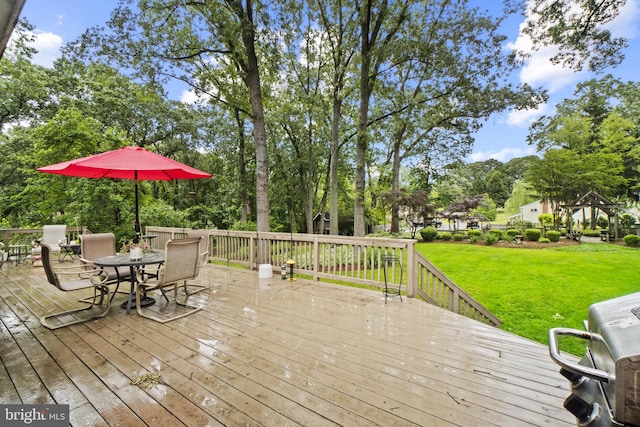 8359 Elm Rd, Millersville, MD 21108 - wooden deck with a lawn, outdoor dining space, and view of scattered trees