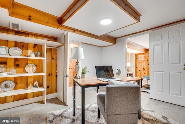 home office with beam ceiling, carpet flooring, and visible vents