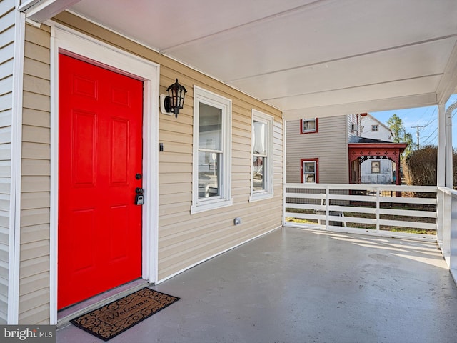 doorway to property with a porch