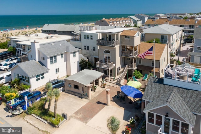 birds eye view of property featuring a residential view and a water view