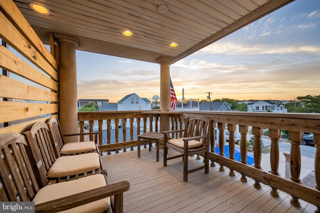 wooden terrace with a residential view