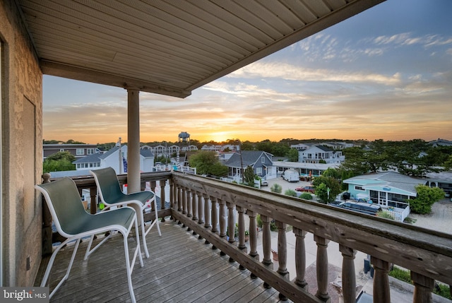 wooden deck with a residential view