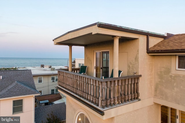 balcony featuring a water view