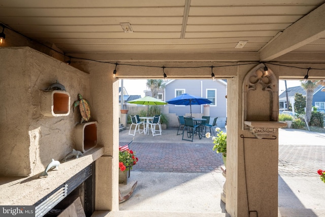 view of patio featuring outdoor dining area and fence