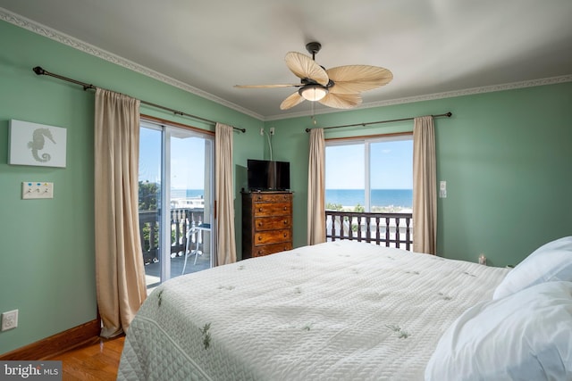 bedroom featuring crown molding, baseboards, wood finished floors, a ceiling fan, and access to outside