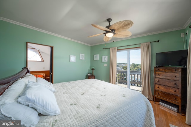 bedroom featuring a ceiling fan, wood finished floors, crown molding, and access to outside